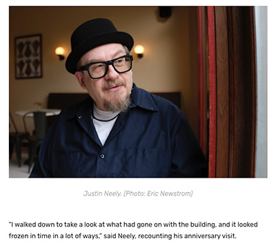 artist justin neely pictured in a black porkpie hat with gaze pointed toward the right of the frame
